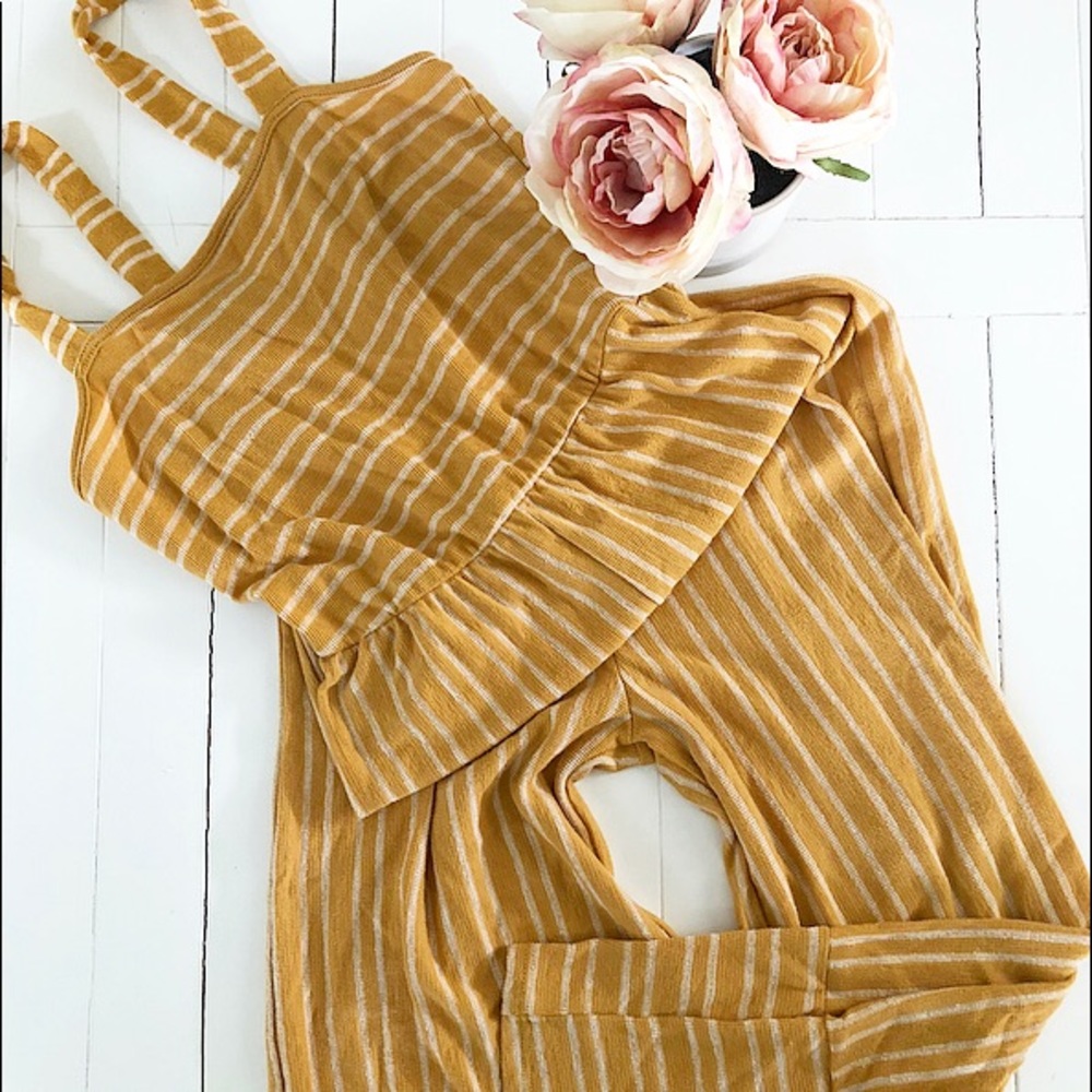 Mustard and white striped striped jumpsuit.